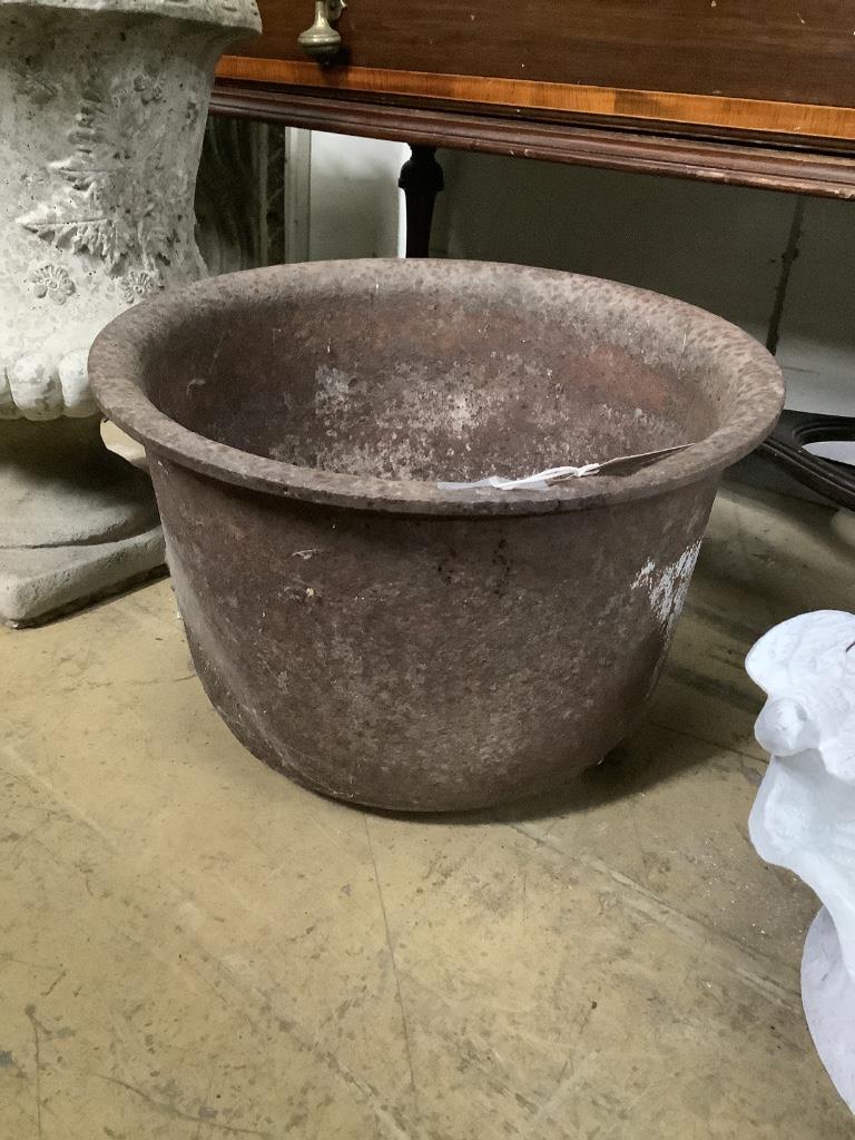 A reconstituted stone planter, height 44cm on base together with a circular cast iron garden planter, width 38cm